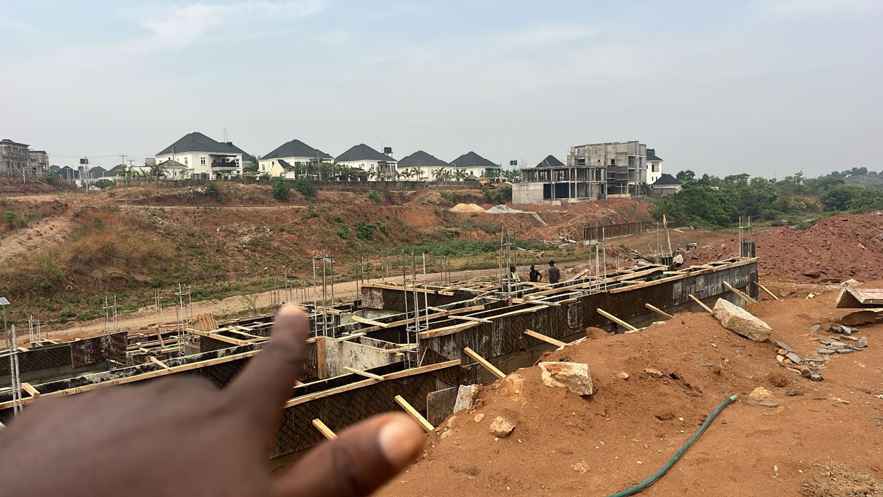 Trusses and structural framing being mounted on residential blocks.